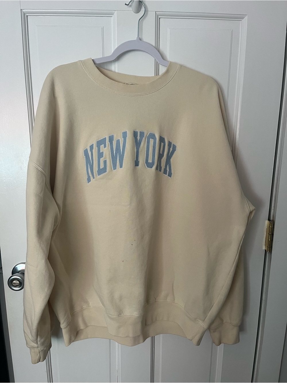 Brandy Melville Cream Crewneck with Light Blue 'New York' Print